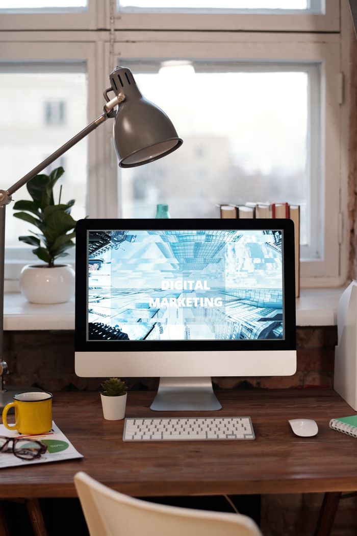 project-01-b Contemporary home office desk with digital marketing screen, perfect for remote work inspiration.